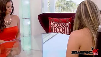 Hispanic couple enjoys meeting other couples before the party in the red room